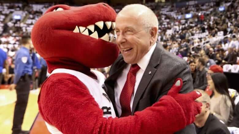 Toronto Raptors co-owner Larry Tanenbaum with the Raptors mascot.