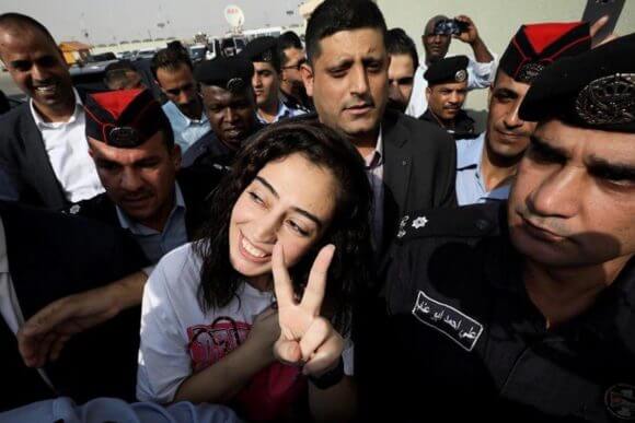 Heba al-Labadi smiles as she is returned to Jordan on Wednesday, November 6 (Photo: Middle East Monitor)