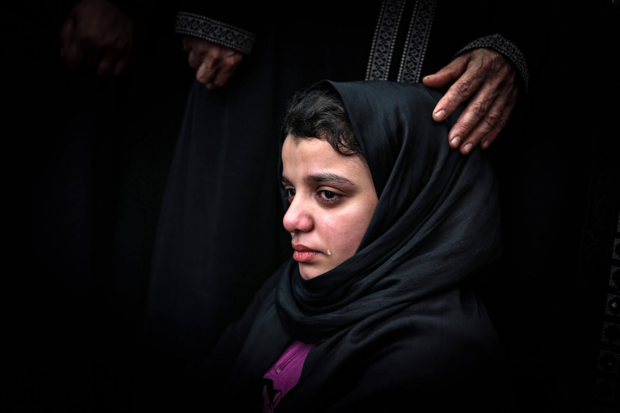 This photo taken on November 12 shows Fatma Abu al-Atta mourning during the funeral of her father, the top Islamic Jihad commander Bahaa Abu al-Atta who was killed by Israeli attack together with his wife Asma. (Photo: Mohammed Zaanoun / Activestills.org)