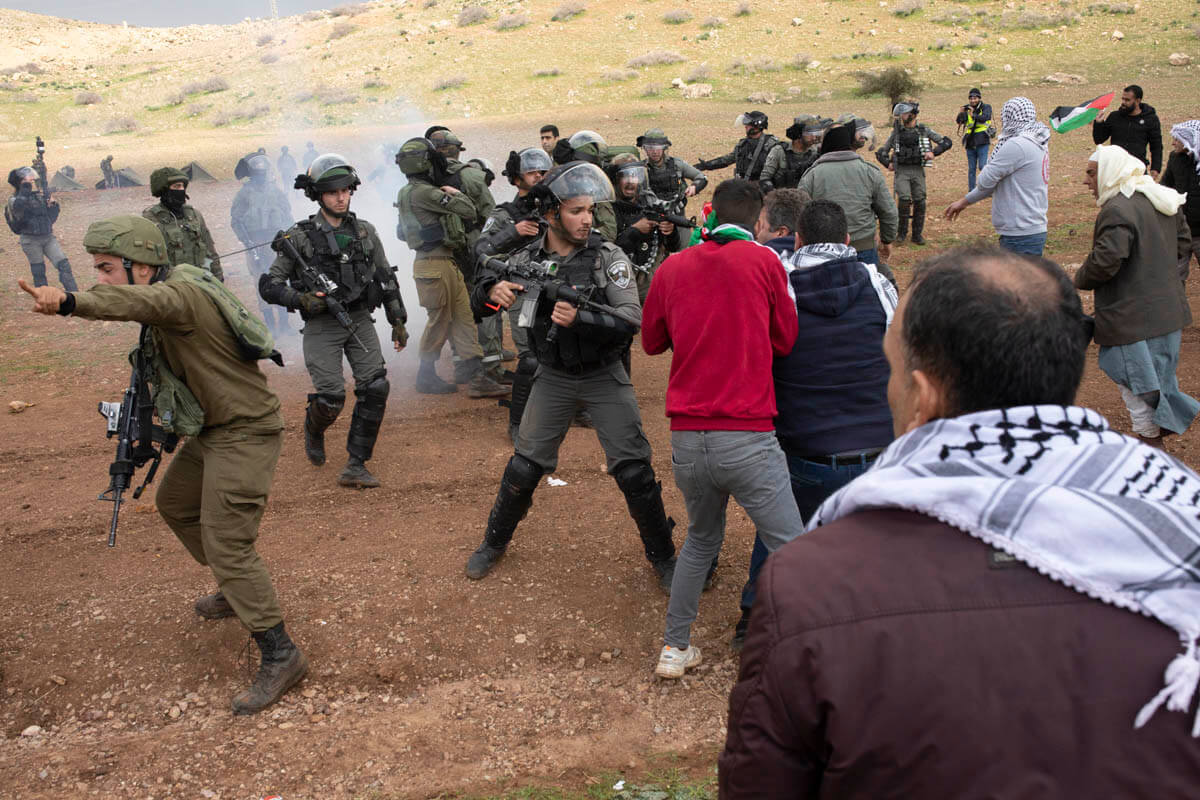 Israeli soldiers fire sound grenades at Palestinians protesters, near Tayseer checkpoint, the Jordan Valley, the West Bank, January 29, 2020. (Photo: Oren Ziv / Activestills)