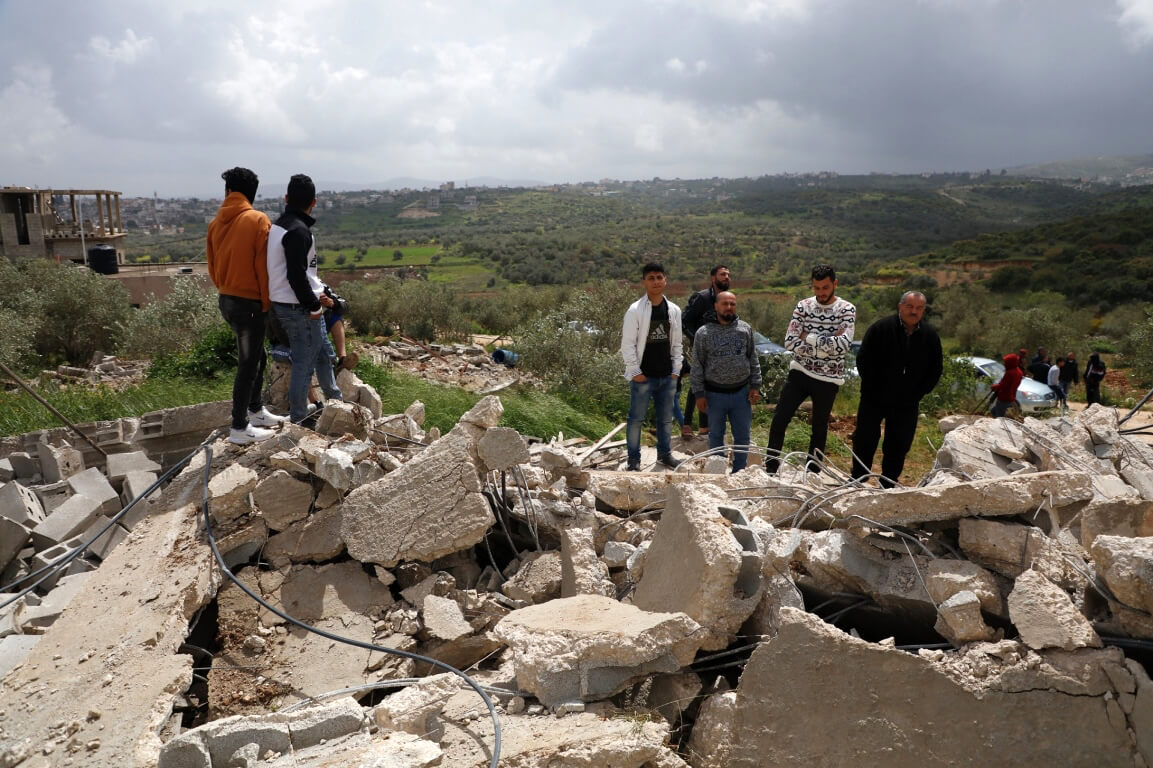 Palestinians inspect three houses demolished by Israeli forces in the village of Rummaneh, in the West Bank city of Jenin, on April 01, 2020. (Photo by Oday Deybes/ WAFA)