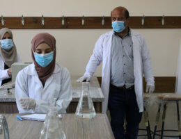 Palestinian students attend their final classes before graduation following the reopening of the Palestine Technical University in al-Aroub, north of the West Bank city of Hebron, on June 8, 2020. (Photo: Mosab Shawer/APA Images)