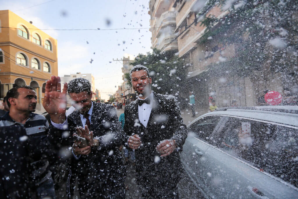 Palestinians enjoy a wedding ceremony amid relaxation of lockdown restrictions in Khan Younis in the southern of Gaza strip on June 11, 2020. (Photo: Ashraf Amra/APA Images)