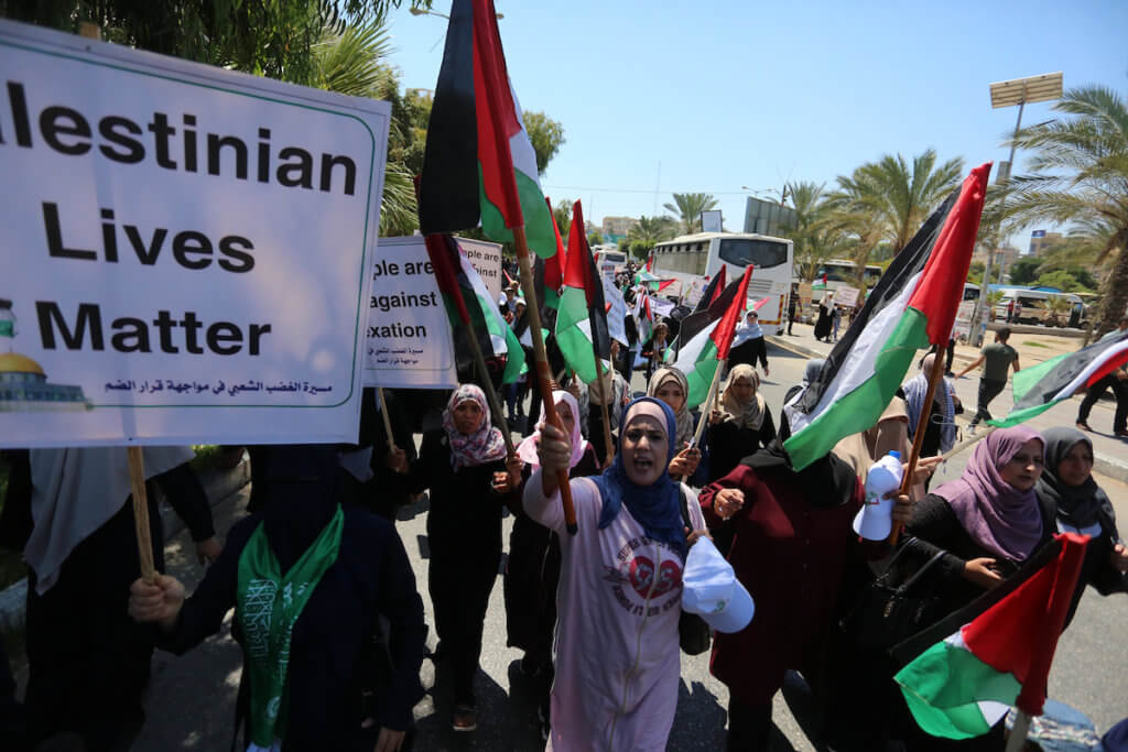 Palestinians hold a demonstration against Israel's West Bank annexation plans in Gaza City on July 1, 2020. (Photo: Ashraf Amra/APA Images)