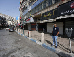 Palestinians walk in the streets during of a mandatory quarantine that was announced by the Palestinian Authority as part of measures against the resurgence of COVID-19 in the West Bank city of Nablus on June 21, 2020. (Photo: Shadi Jarar’ah/APA Images)