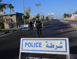 Palestinian policemen wear face masks in Deir Al Balah in the central Gaza Strip on August 26, 2020. (Photo: Ashraf Amra/APA Images)