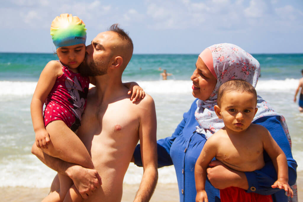 A Palestinian family from the West Bank enjoys visiting the sea in Jaffa, August 3, 2020 (Photo: Dareen Tatour)
