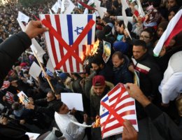 Tunisians burn images of the US and Israeli flags at a demonstration against Donald Trump's recognition of Jerusalem as Israel's capital. in Tunis, Tunisia on December 8, 2017 (AFP PHOTO/FETHI BELAID /Getty)