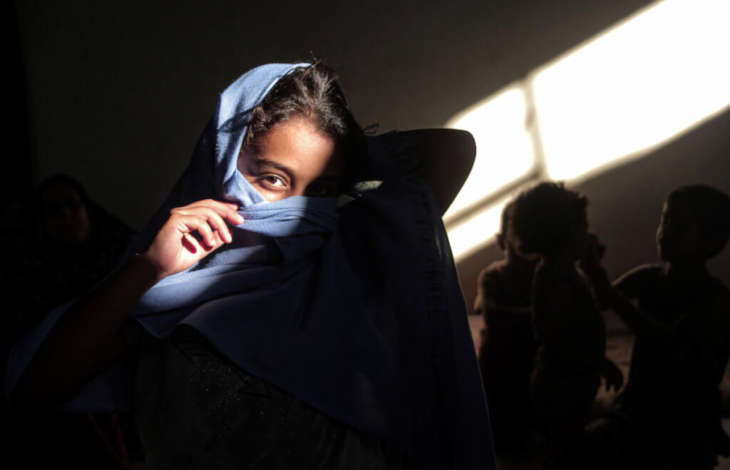 A Palestinian family stays at home during a lockdown following the outbreak of the coronavirus in Gaza City September 2, 2020. (Photo: Mohammed Salem/APA Images)