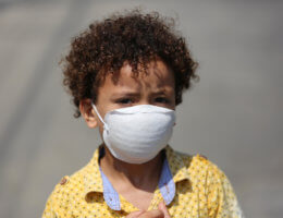 A Palestinian boy poses for a photo as he wears a face mask to protect himself against COVID-19, in Deir Al Balah in the central of Gaza Strip, on September 6, 2020. (Photo: Ashraf Amra/APA Images)
