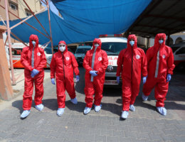 Employees of the Palestine Red Crescent Society wearing protective gear in Deir Al Balah in the central of Gaza Strip, on August 30, 2020. (Photo: Ashraf Amra/APA Images)