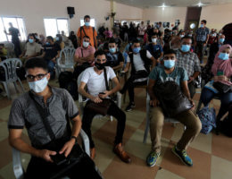 Palestinians wear face masks, as they wait for travel permits to cross into Egypt through the Rafah border crossing, which was reopened partially amid the spread of the coronavirus disease (COVID-19), in Rafah in the southern of Gaza Strip, on September 29, 2020. (Photo: Ashraf Amra/APA Images)