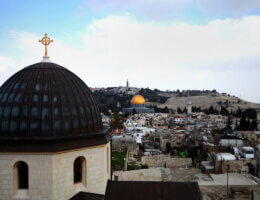 A general view from the tower of the Church of Redeemer shows the Dome of the Rock and the cross of the Church of the Holy Sepulchre in the old city of Jerusalem, on February 17, 2014. Photo by Saeed Qaq