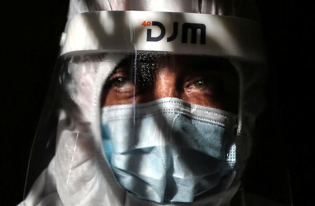 A Palestinian medical worker wearing protective gear conducting COVID-19 testing inside a mosque in Deir al-Balah, Gaza Strip, on January 11, 2021. (Photo: Ashraf Amra/APA Images)