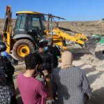 Palestinians gather as Israeli forces demolish the house of Rasmi Abu Aram in Khirber Ar-Rakeez and the house of Hatem Makhamra in Khirbet at-Tuwani, November 25, 2020. (Photo: Mosab Shawer/APA Images)