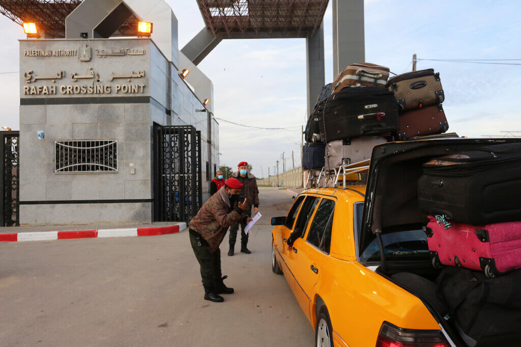 Palestinians wait for travel permits to enter into Egypt through the Rafah border crossing, in Rafah in the southern of Gaza Strip, on February 9, 2021. (Photo: Ashraf Amra/APA Images)