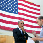 Barack Obama talks with Ben Rhodes, Deputy National Security Advisor for Strategic Communications, after delivering a statement on the murder of journalist Jim Foley by the terrorist group ISIL, at the Edgartown School in Edgartown, Martha's Vineyard, Mass., Aug. 20, 2014. (Official White House Photo by Amanda Lucidon)