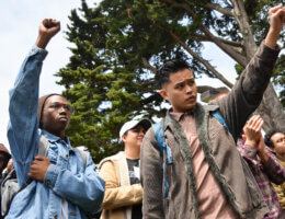 Students raise their fist in solidarity with the Third World Liberation Front 2016, the name of the four students on a hunger strike to defend the funding of the SF State College of Ethnic Studies, during an emergency press conference in the Quad Monday, May 9, 2016. (Photo: Melissa Minton/Creative Commons/Flikr)