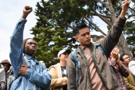 Students raise their fist in solidarity with the Third World Liberation Front 2016, the name of the four students on a hunger strike to defend the funding of the SF State College of Ethnic Studies, during an emergency press conference in the Quad Monday, May 9, 2016. (Photo: Melissa Minton/Creative Commons/Flikr)