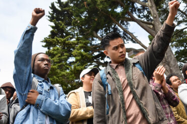 Students raise their fist in solidarity with the Third World Liberation Front 2016, the name of the four students on a hunger strike to defend the funding of the SF State College of Ethnic Studies, during an emergency press conference in the Quad Monday, May 9, 2016. (Photo: Melissa Minton/Creative Commons/Flikr)