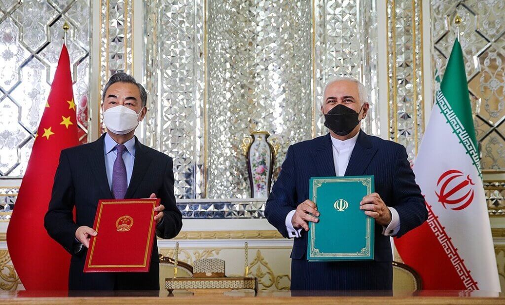 Wang Yi and Mohammad Javad Zarif at the Ministry of Foreign Affairs of Iran, after signing the 25-year cooperation deal between China and Iran, March 27, 2021. (Photo: Mohammad Sadegh Nikgostar/Fars News via Wikimedia)