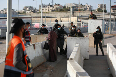 Palestinians wait to cross the Qalandia checkpoint between the West Bank city of Ramallah and Jerusalem, to attend the first Friday prayers in Al-Aqsa mosque, during the Muslim holy month of Ramadan on April 16, 2021. A limited number of Palestinian residents who carry both a travel permits and a vaccination document, are allowed to cross into Israel to attend the prayers at Al-Aqsa mosque. (Photo: APA Images)