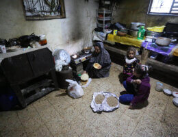 A Palestinian woman prepares breakfast during the holy month of Ramadan in Deir al-Balah refugee camp in central Gaza on April 20, 2021. (Photo: Ashraf Amra/APA Images)