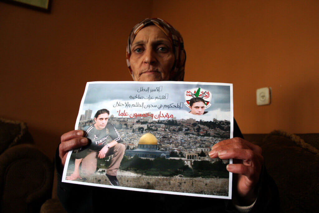 The mother of the Haitham Salhiyah, who survived an alleged assassination attempt inside an Israeli prison organized by the Shin Bet, January 19, 2011, (Photo: Issam Rimawi/APA Images)