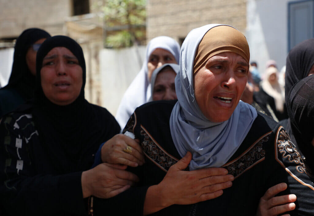 The mother of Palestinian Rashid Muhammad Abu Arreh, 16, who was killed by Israeli troops in the village of Aqaba near Tubas in the occupied West Bank mourns during his funeral on May 12, 2021. (Photo: Oday Daibes/APA Images)