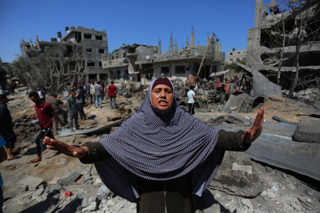 Palestinians inspect homes that were destroyed by an Israeli airstrike in Beit Hanoun in the northern Gaza Strip on May 14, 2021. (Photo: Ashraf Amra/APA Images)