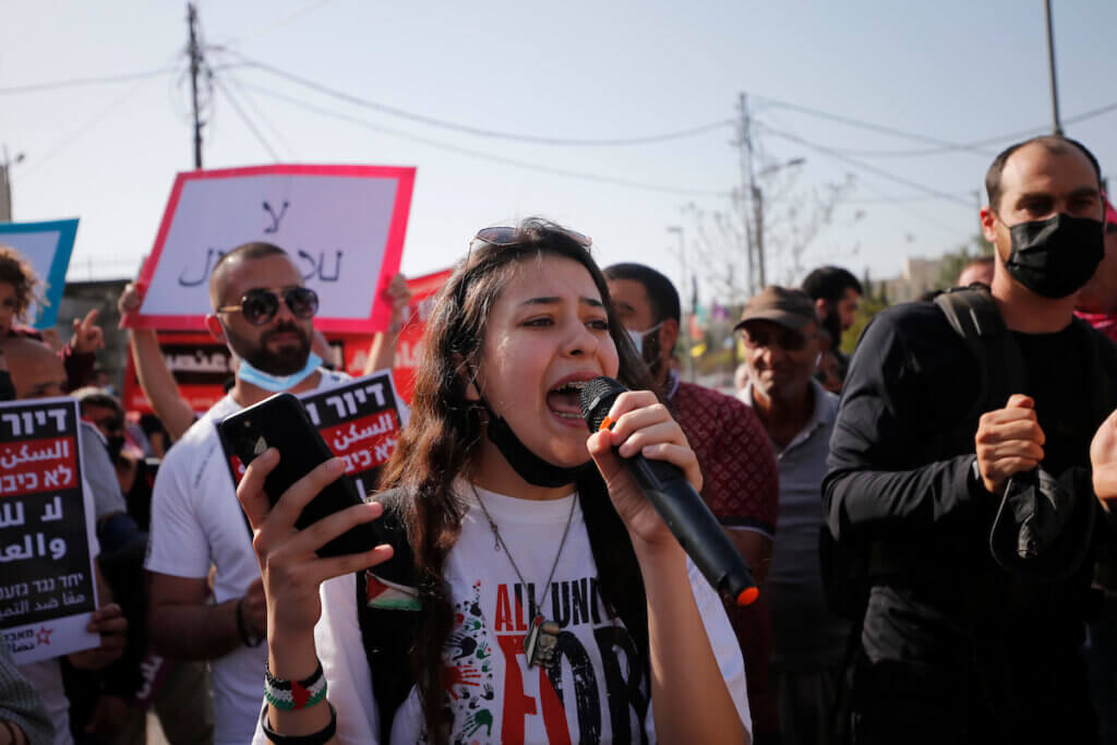 Palestinian activists gather in front of an Israeli settler home during a demonstration against the evictions of Palestinian families in the Palestinian neighborhood of Sheikh Jarrah, in East Jerusalem on April 16, 2021. (Photo: Jamal Awad/APA Images)
