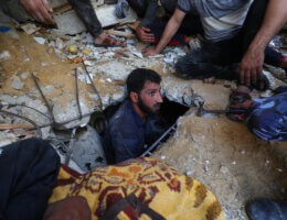 Palestinian rescue teams search for survivors under the rubble of a destroyed building in Gaza City's Rimal residential district on May 16, 2021, following massive Israeli bombardment overnight. (Photo: Ashraf Amra/APA Images)