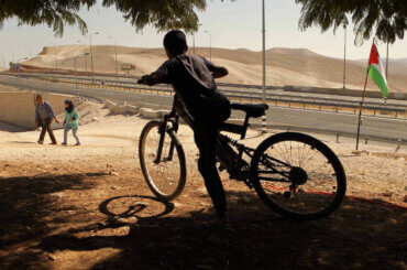 A Palestinian Bedouin school boy walks in the village of Khan al-Ahmar in the West Bank on September 16, 2018. (Photo: Wisam Hashlamoun/APA Images)