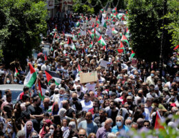 Palestinians protesting against Israel's occupation and its air campaign on the Gaza strip, shout slogans as they face Israeli troops near the settlement of Beit El and Ramallah in the occupied West Bank on May 18, 2021. (Photo: Ibrahim Attaia/APA Images)