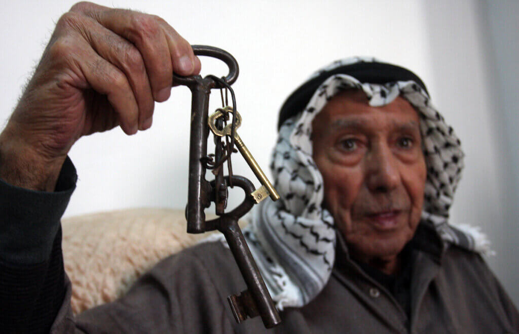 A Palestinian refugee holds the keys to the house he was forced from in 1948, in the Al Jalazoun refugee camp in the West Bank City of Ramallah on May 14 2012. (Photo: Issam Rimawi/APA Images)