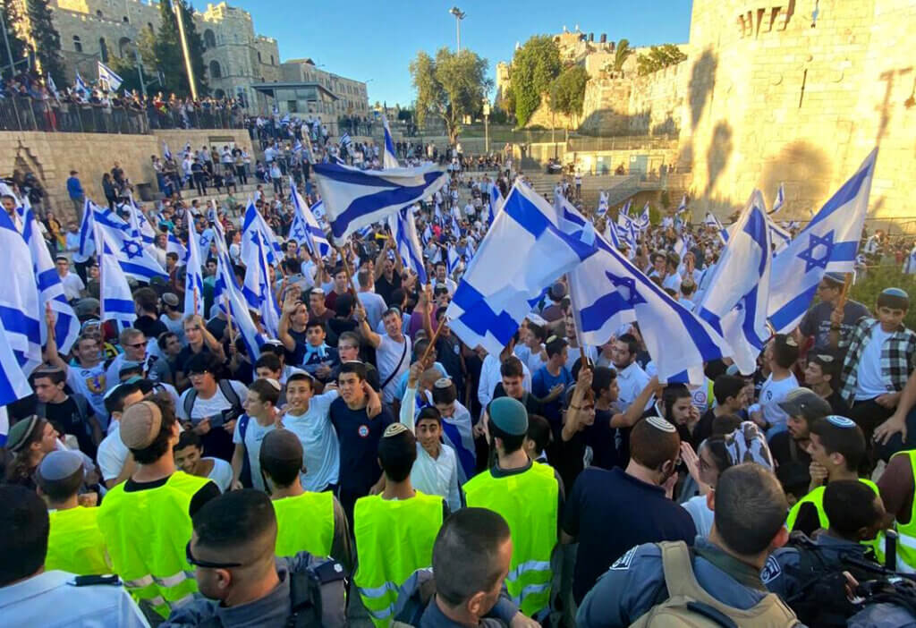 Jewish ultranationalists wave Israeli flags during the "Flags March," next to Damascus gate, outside Jerusalem's Old City, Tuesday, June 15, 2021. (Photo by WAFA via APA Images)