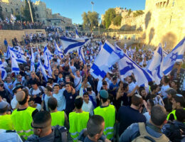 Jewish ultranationalists wave Israeli flags during the "Flags March," next to Damascus gate, outside Jerusalem's Old City, Tuesday, June 15, 2021. (Photo by WAFA via APA Images)