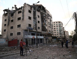 Palestinians inspect the damage to the Ministry of Health headquarters in Gaza City after it was hit by an Israeli airstrike, May 17, 2021. (Photo: Naaman Omar/APA Images)