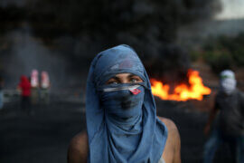 Palestinians take part in a demonstration against the expansion of a Jewish settlement on the lands of Beita village, near the occupied West Bank city of Nablus, on June 23, 2021. (Photo: Shadi Jarar'ah/APA Images)