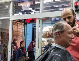 Richard Smith gets a haircut in Jerusalem on his first trip to Palestine, 2019.