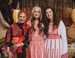 The author (center), my mother Shorouq (right) and my mother in law Wafa (left) at my Palestinian henna party the night before our wedding in 2017. A traditional wedding celebration that many of us still keep alive here in the west, where we dress in traditional Palestinian Thobes draped with Tatreez (Palestinian embroidery), have bridal henna done on our hands, and dance all night eating sweets and celebrating our soon-to-be union.