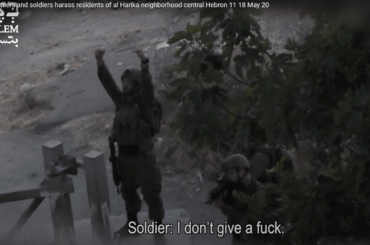 Screenshot of B'Tselem video of Israeli soldier taunting Palestinians in occupied Hebron, May 13, 2021.