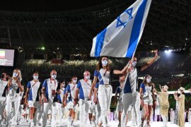 Flag bearers Hanna Minenko and Yakov Toumarkin of Team Israel during the Opening Ceremony of the Tokyo 2020 Olympic Games, July 23, 2021 (Photo: Getty Images/Matthias Hangst)