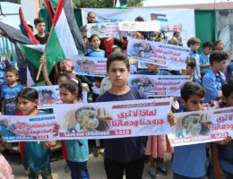 Palestinian children take part in a protest against the Israeli blockade on Gaza Strip, in front of Erez crossing, in Beit Hanoun in the northern Gaza Strip on August 24, 2021. (Photo: Ashraf Amra/APA Images)