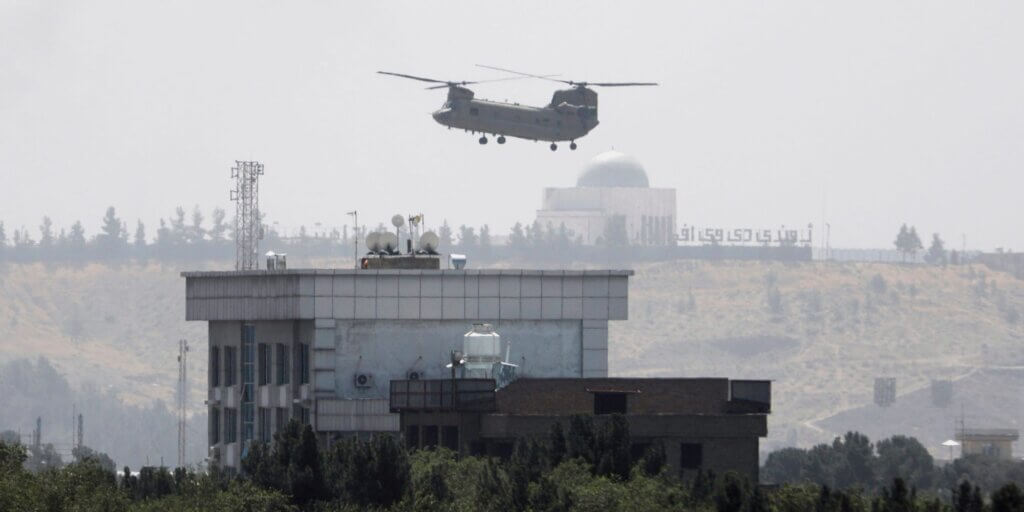 A U.S. helicopter flies near the U.S. Embassy in Kabul, Afghanistan, Sunday, Aug. 15, 2021. Helicopters were landing at the U.S. Embassy in Kabul as diplomatic vehicles left the compound amid the Taliban advanced on the Afghan capital. (Photo: AP Photo/Rahmat Gul)