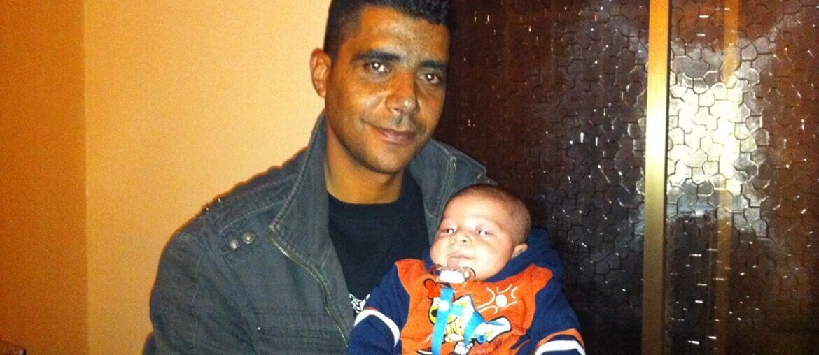 Zakaria Zubeidi holding his son in 2010. (Photo: Udi Aloni)