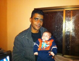 Zakaria Zubeidi holding his son in 2010. (Photo: Udi Aloni)
