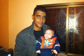 Zakaria Zubeidi holding his son in 2010. (Photo: Udi Aloni)