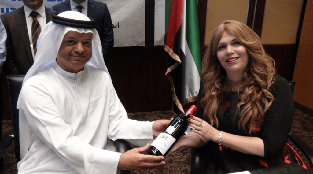 Tura Winery co-owner Vered Ben Sa’adon, right, attends a signing ceremony for a business deal in Dubai, December 7, 2020. Tura is based in the illegal West Bank settlement of Rechelim. (Photo: Tura Winery)