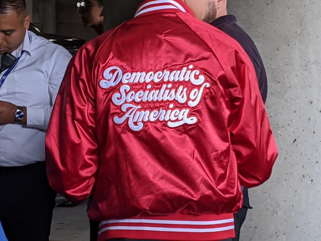 Democratic Socialists of America jacket from San Francisco, Bernie Sanders Rally, LA Convention Center, Los Angeles, March 2020 (Photo: Cory Doctorow via Wikimedia)